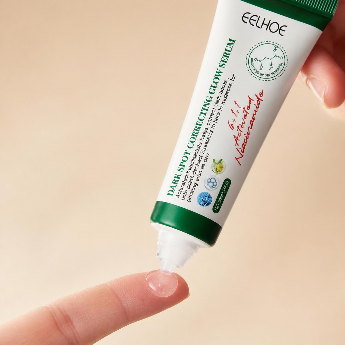 A hand holding a white and green tube of EELHOE Dark Spot Correcting Glow Serum, with the clear gel being squeezed onto a fingertip against a soft beige background.